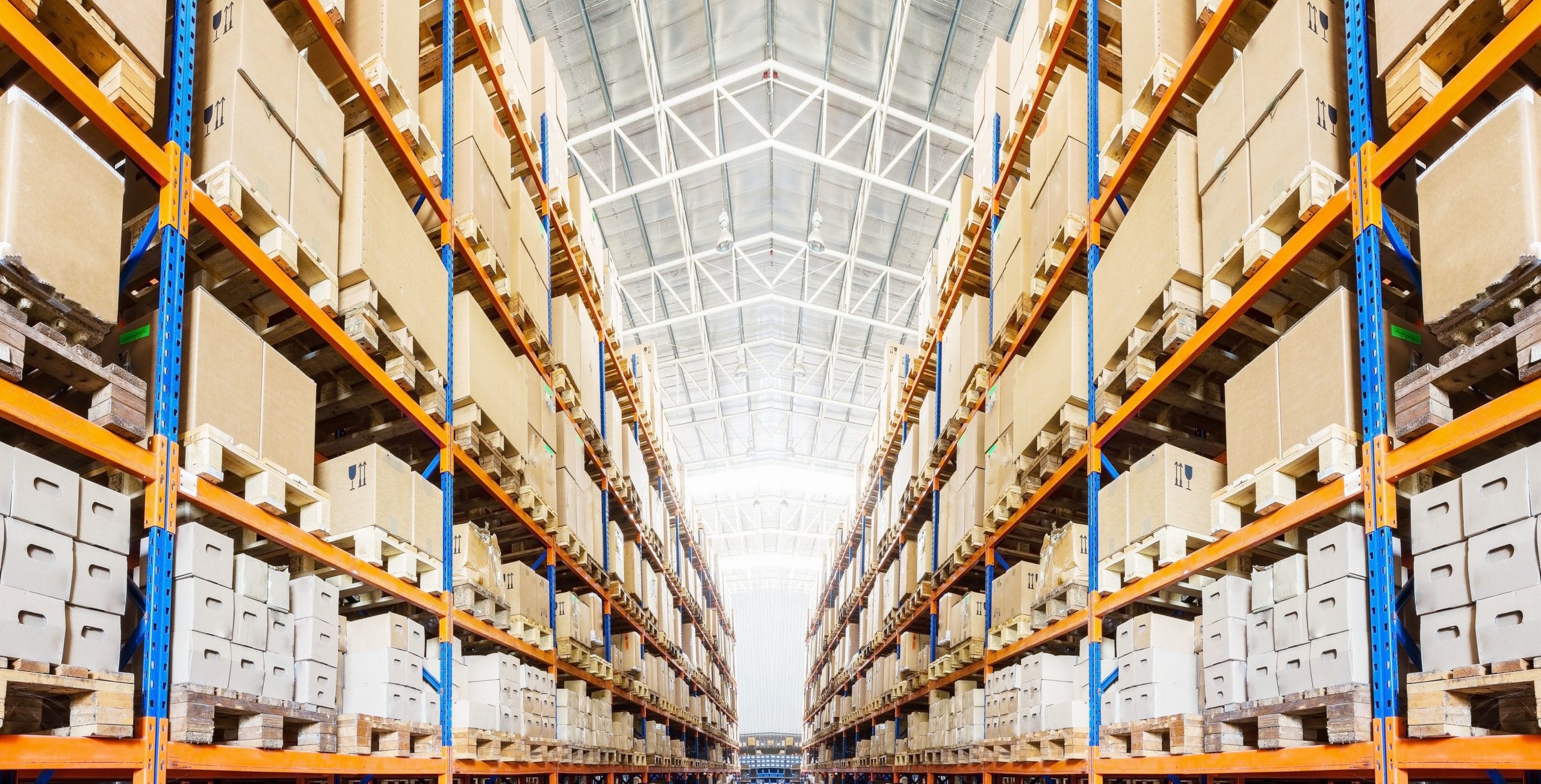 rows of shelves with boxes in modern warehouse 686616360 5b8032b546e0fb0025661358 scaled