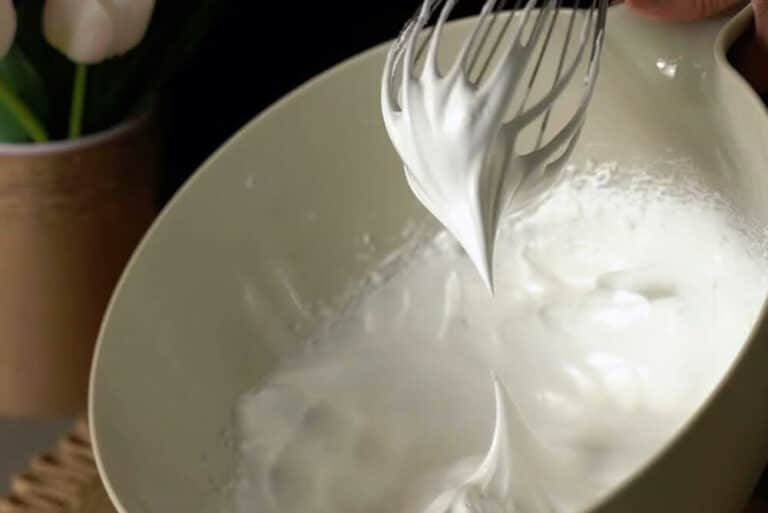 Close up of a person preparing whipped cream