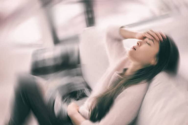 A young woman feeling unwell after misusing nangs